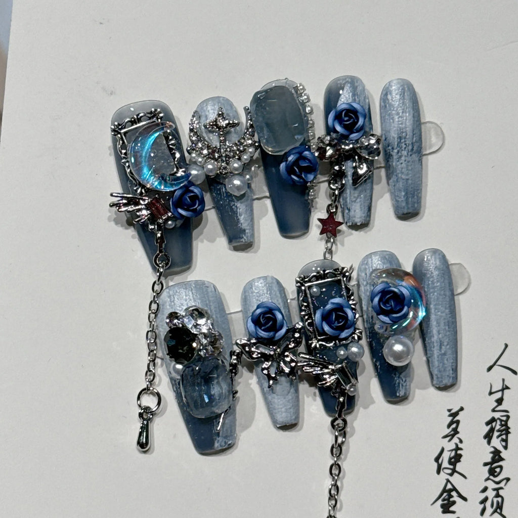 Blue plastic nail armour suit with rose and tulip patterns for evening wear.