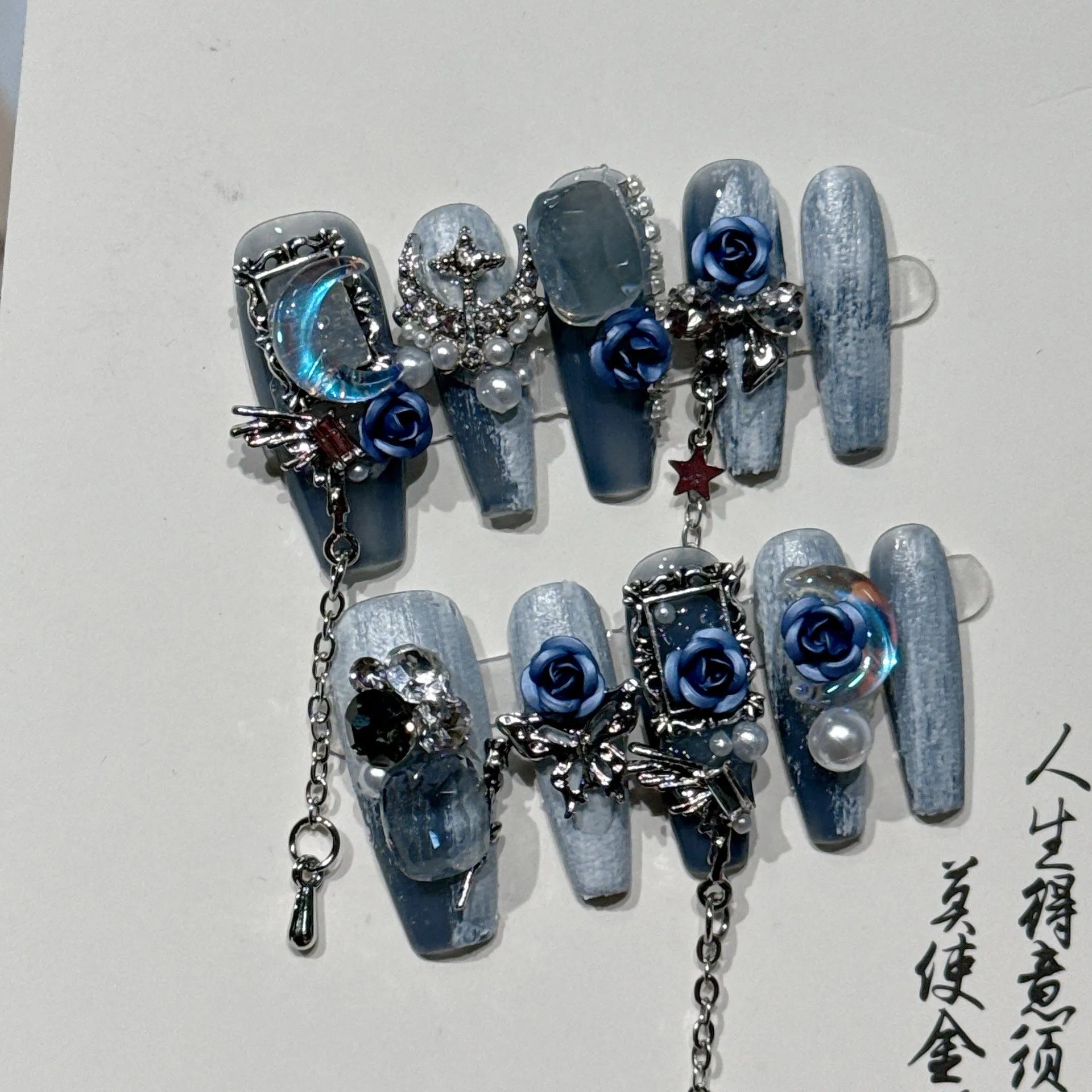 Blue plastic nail armour suit with rose and tulip patterns for evening wear.