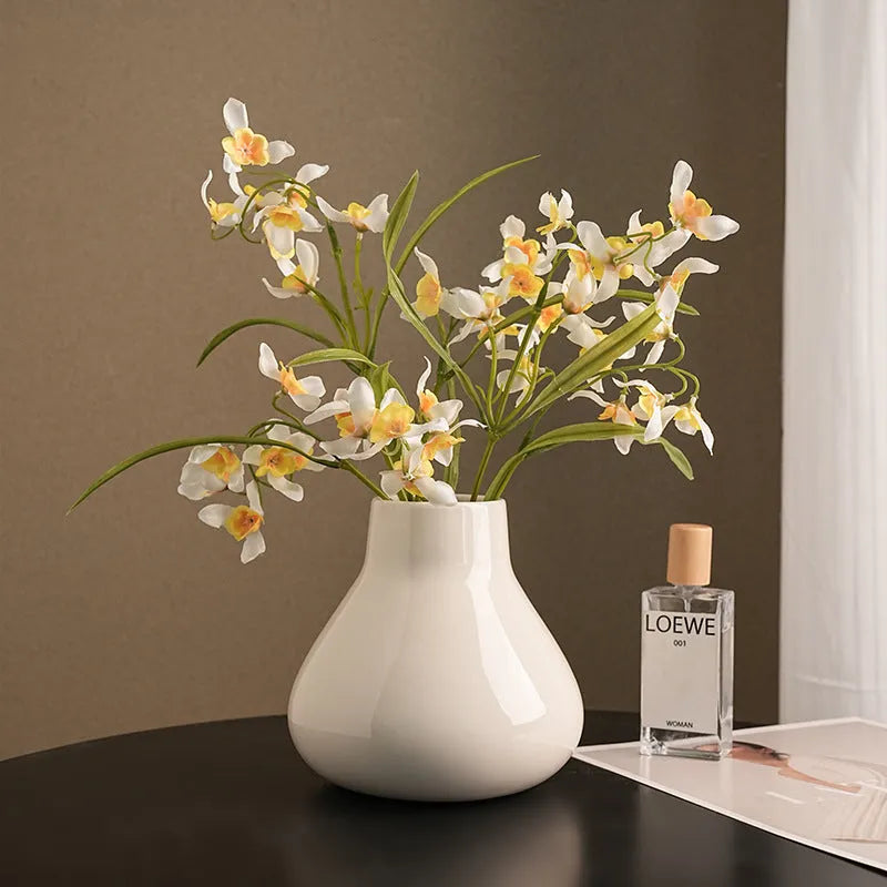 Ceramic round belly vase with black or white coloured glaze finish and modern simplicity design