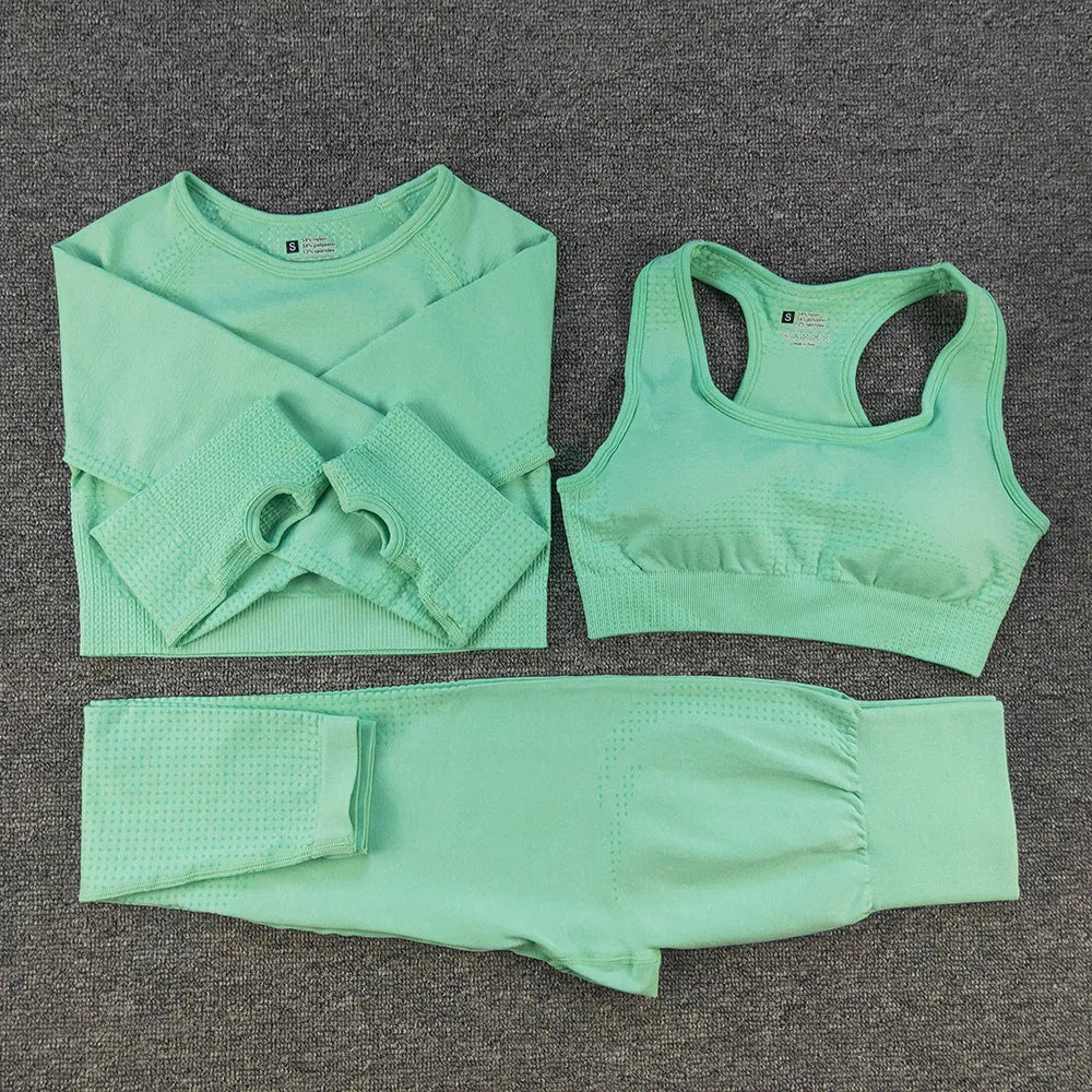 Three-piece yoga suit with long sleeve top, trousers, and bra in nylon blend, tight fit, sizes S to XL