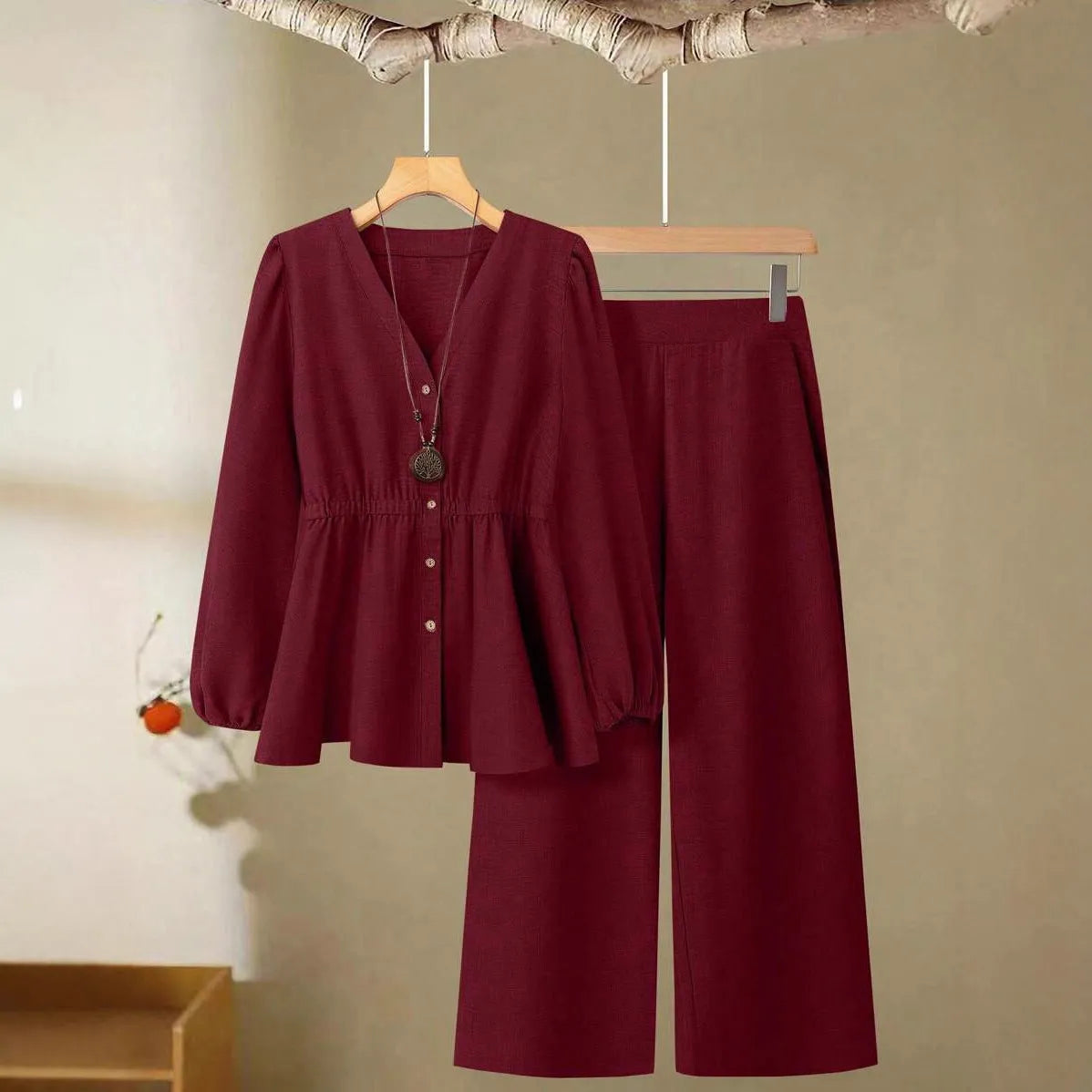 Women's polyester two-piece suit in khaki with long sleeves, button detailing, and matching trousers