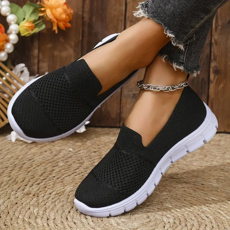 Women's mesh breathable flat casual shoes in black, round toe, PVC sole, side view