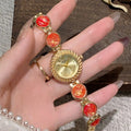 Women's round quartz watch with 25mm dial in zinc alloy case, showing colour options.