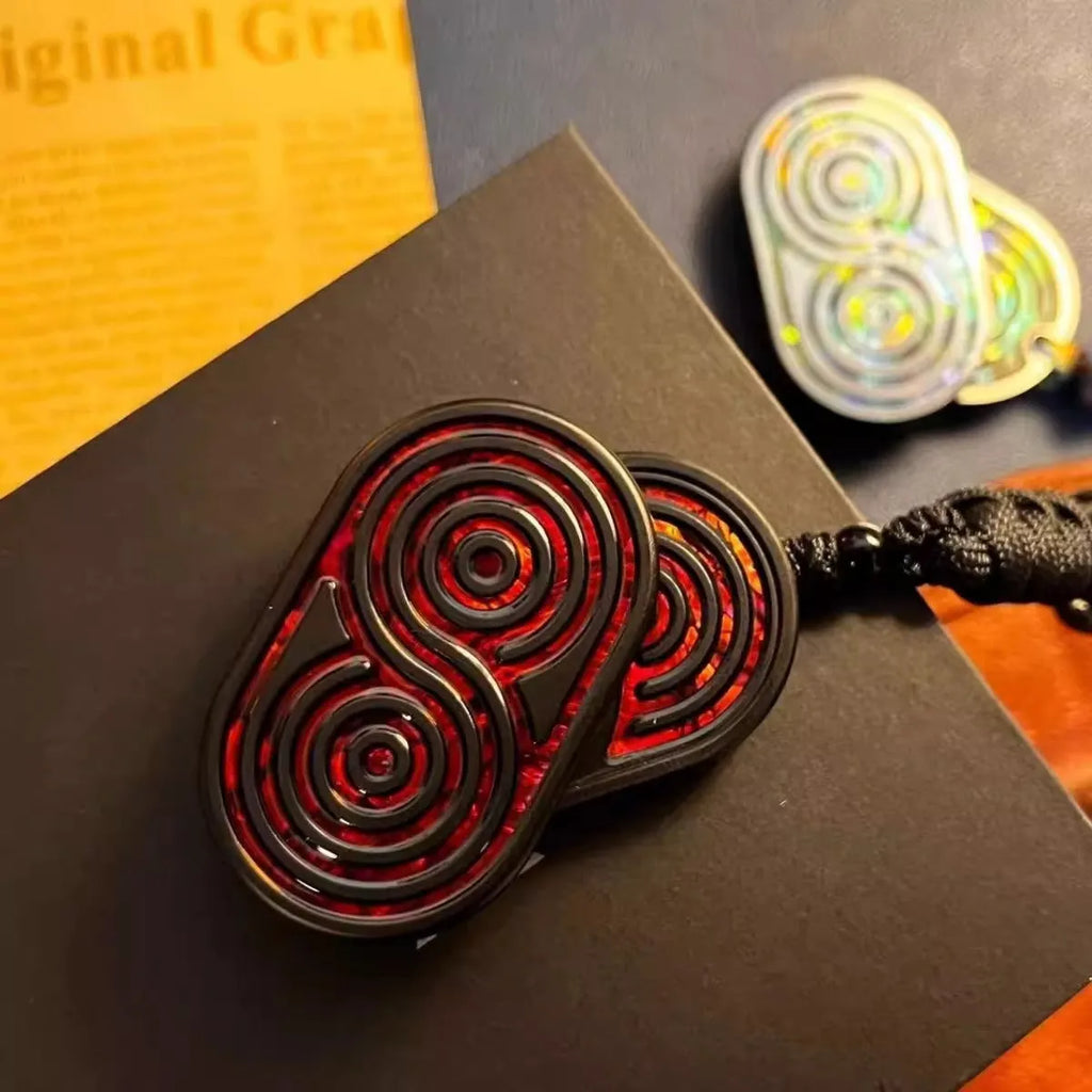 Stainless steel EDC hand push coin fidget toy in Agate Red colour on surface