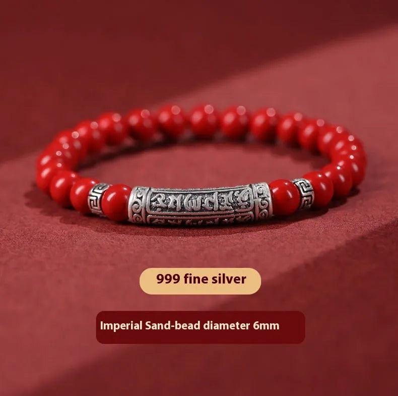 Handmade cinnabar sandstone bracelet in purple gold sand colour with 8mm beads on a wrist.