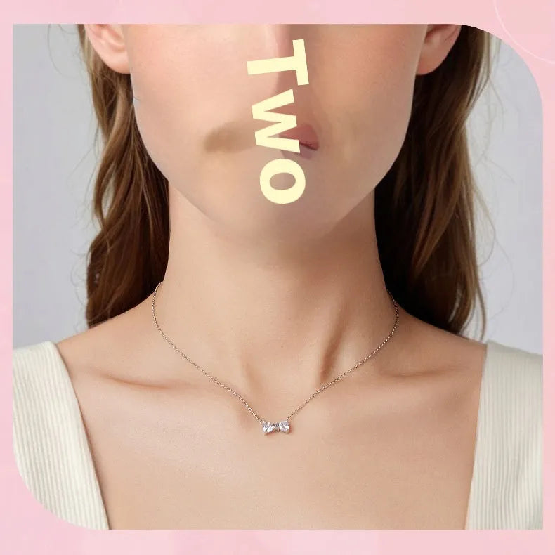 925 sterling silver bow pendant necklace on O-ring clavicle chain in colour BSN434, 41-50cm perimeter