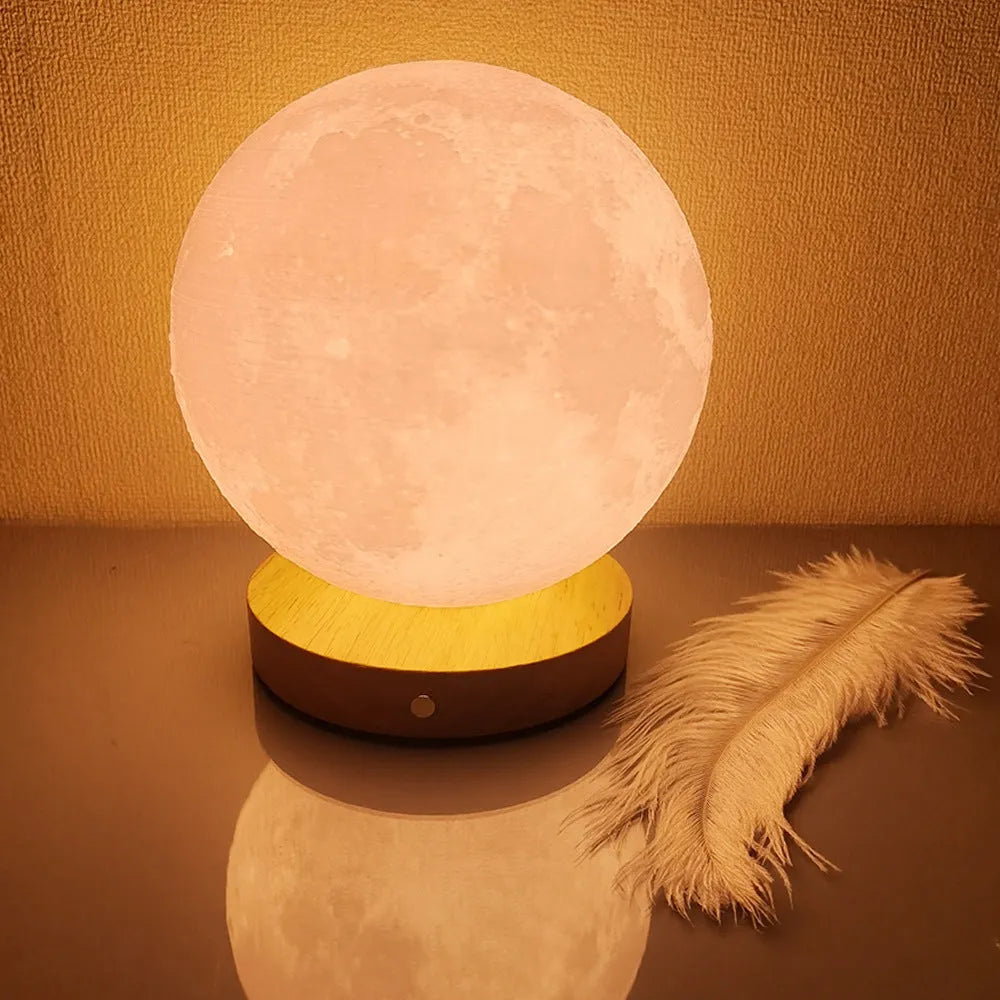 Rotating moon night lamp with wooden base showing three colour lighting options