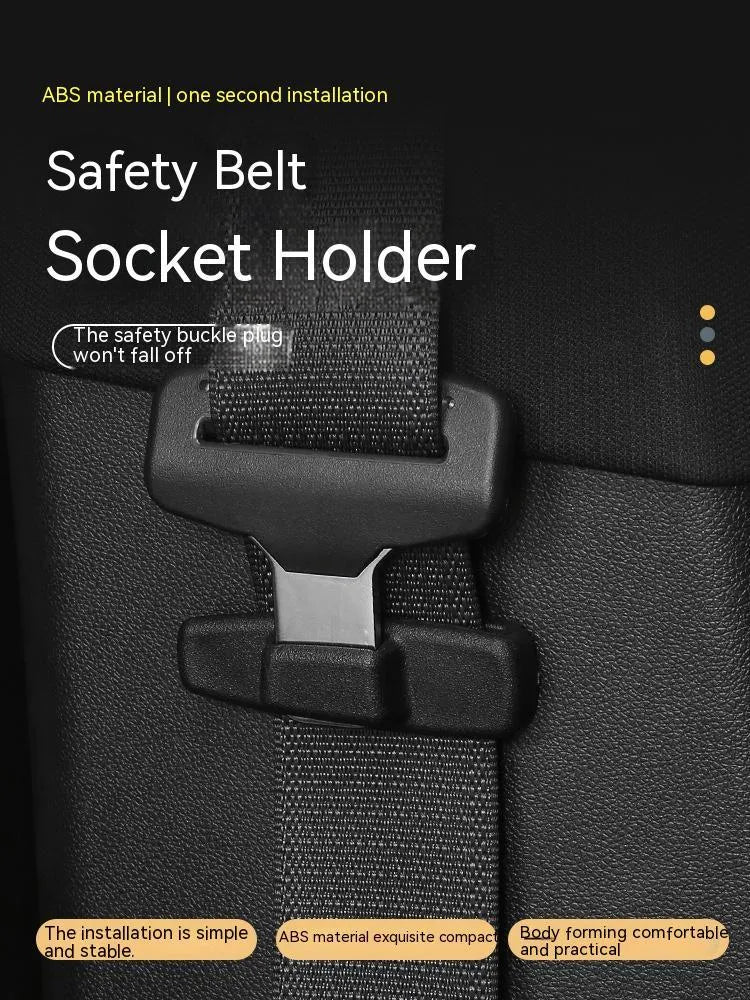 Two black ABS plastic car seatbelt stopper clips for adjusting length and preventing neck pinch.