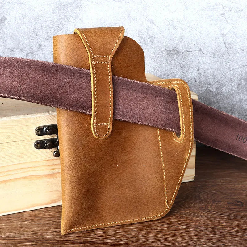Men's brown leather hanging belt bag with car suture detailing and a flap closure