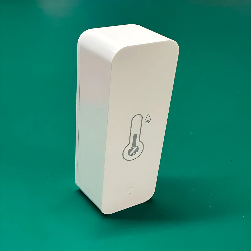 Compact white WiFi temperature and humidity sensor with LCD display for smart home monitoring