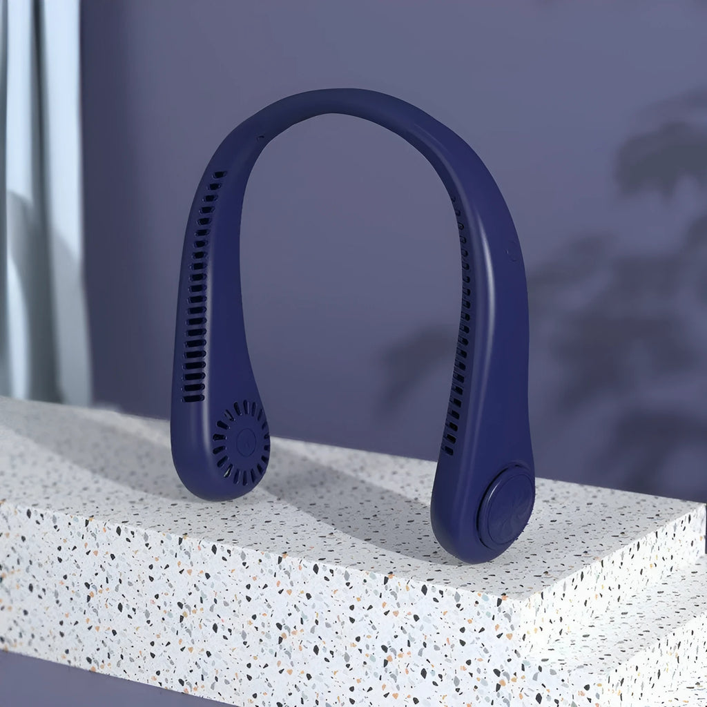 Blue bladeless neck fan hanging around a person's neck, showing the USB charging port and control buttons.