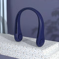 Blue bladeless neck fan hanging around a person's neck, showing the USB charging port and control buttons.