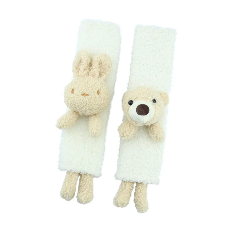 Cartoon rabbit and bear designs on a soft lamb wool car seatbelt shoulder protector.