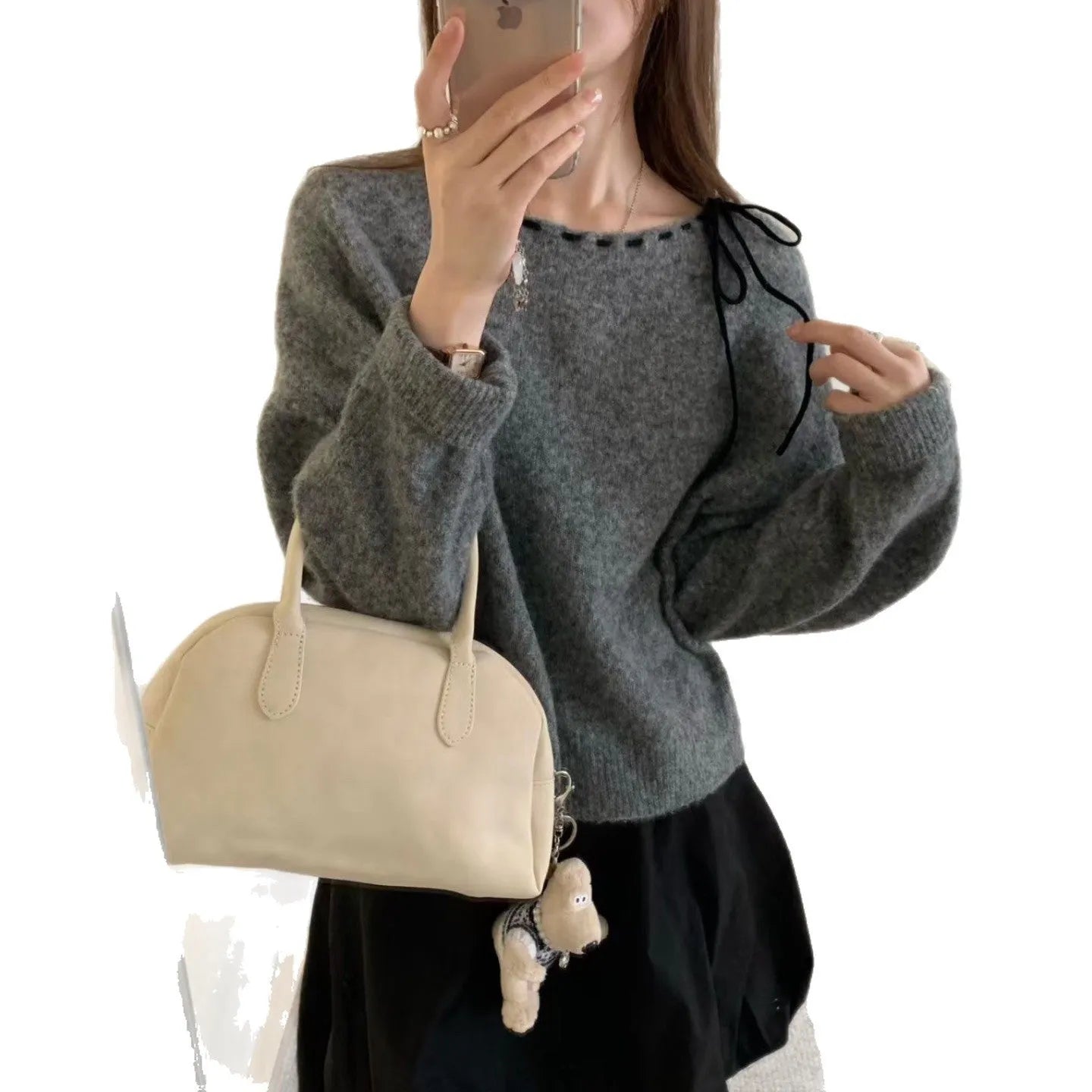 Women's loose-fitting black knitwear pullover jumper made from regenerated cellulose fibre.