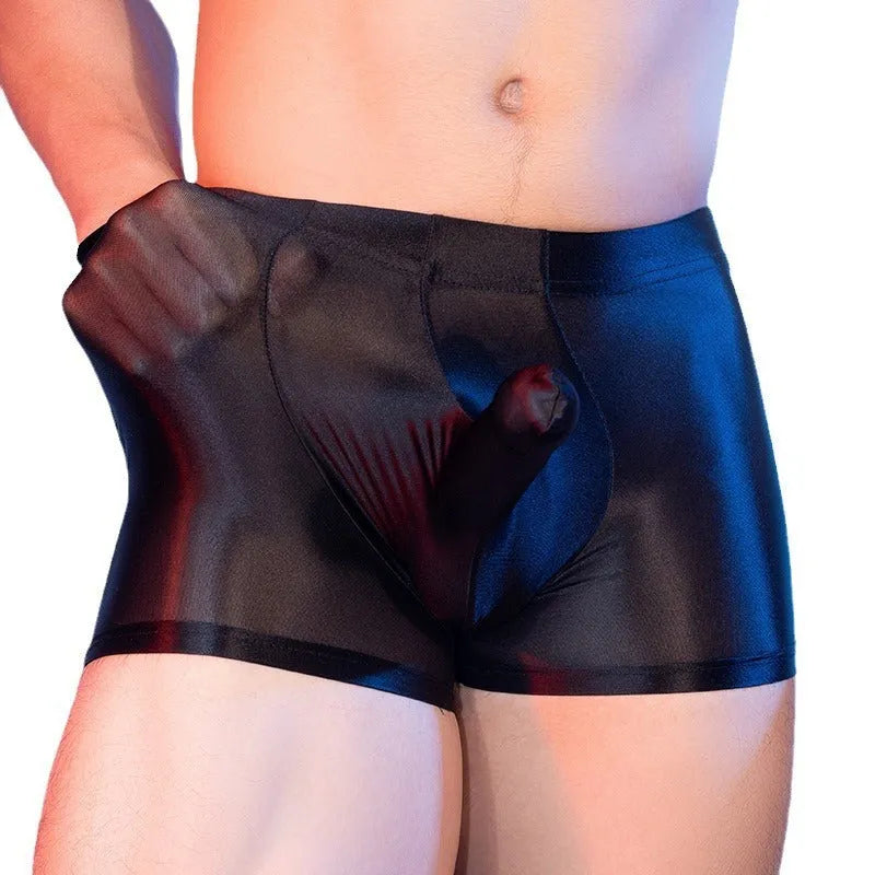 Men's red boxer shorts with a black elephant nose novelty print, showing mid-waist and seamless design.