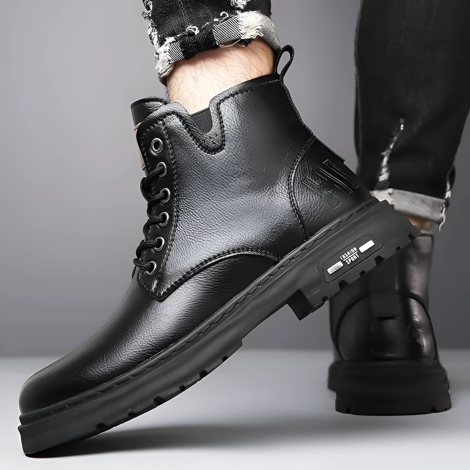 Men's black British Martin lace-up boots with thick rubber sole and round toe on a neutral background.