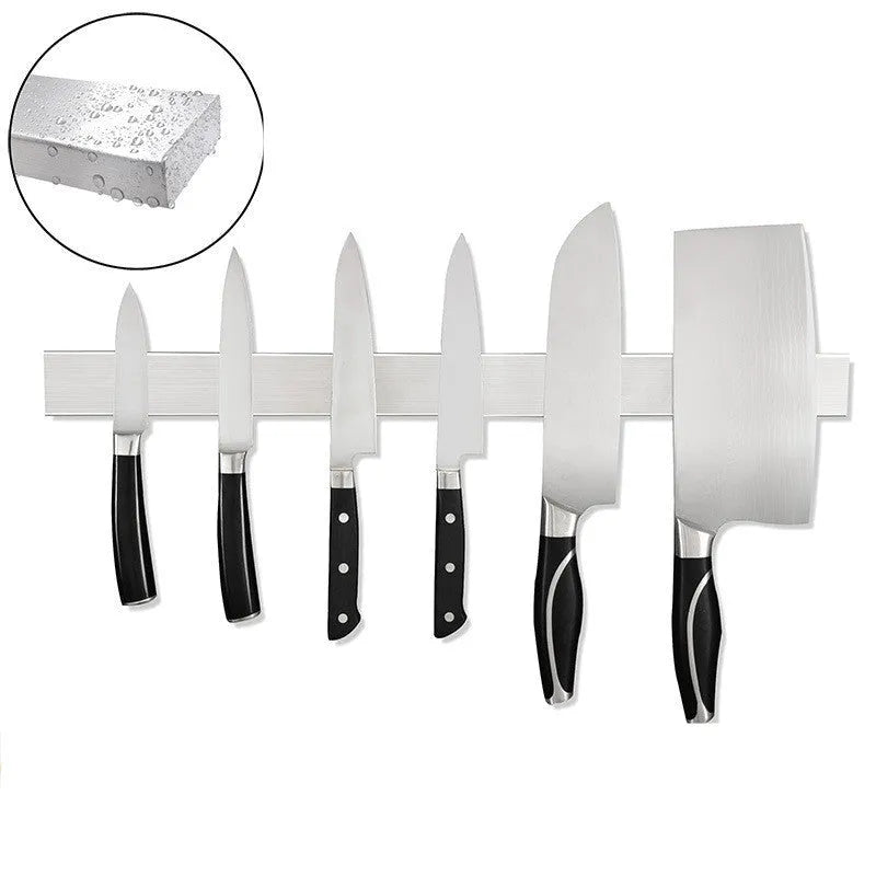 Stainless steel wall-mounted magnetic knife storage rack in various lengths on a kitchen wall.