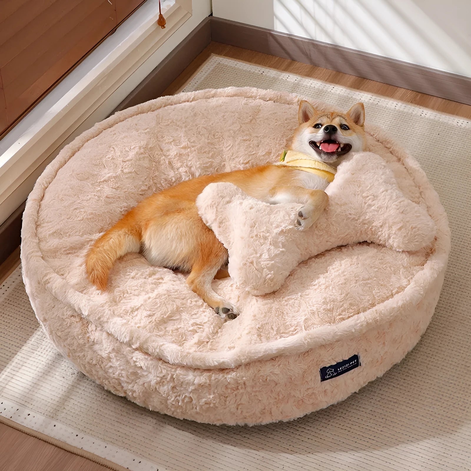Round milk tea coloured pet bed with a removable cloth cover, shown in size L.