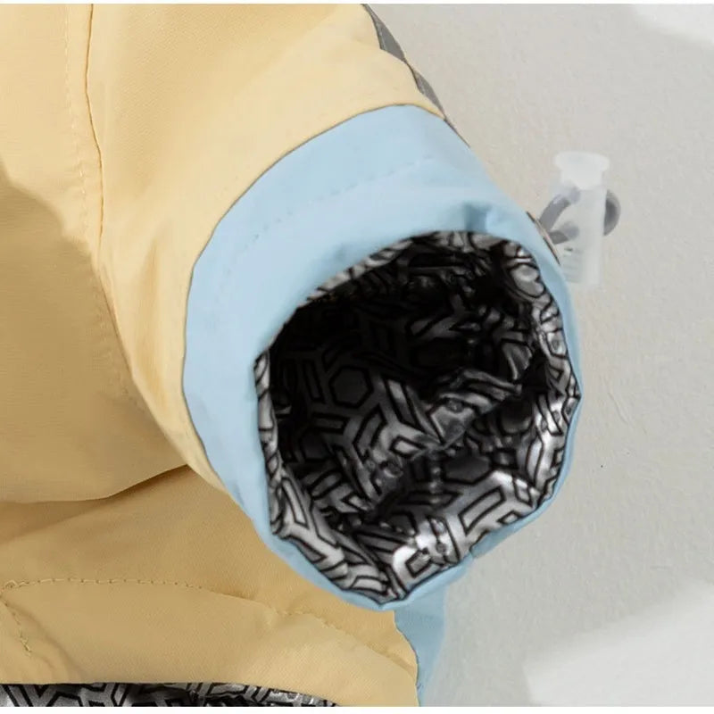 Dog windbreaker in sunny yellow-blue colour block, windproof two-legged cotton coat with tall collar and D-ring on a small dog