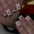 Short white French style press-on nails with bow, tulip, and leopard print designs.