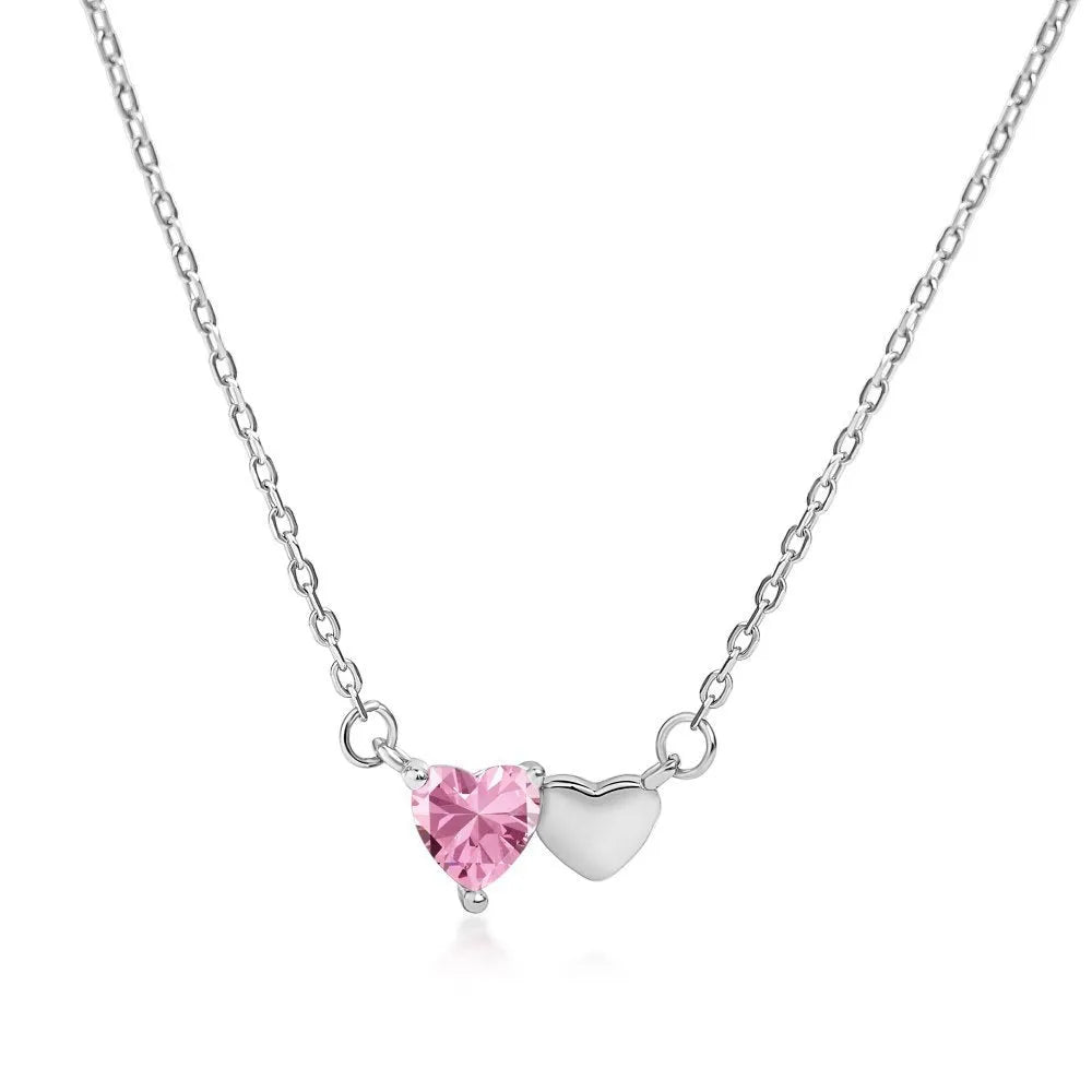 925 silver heart necklace with emerald zircon in gold finish on display
