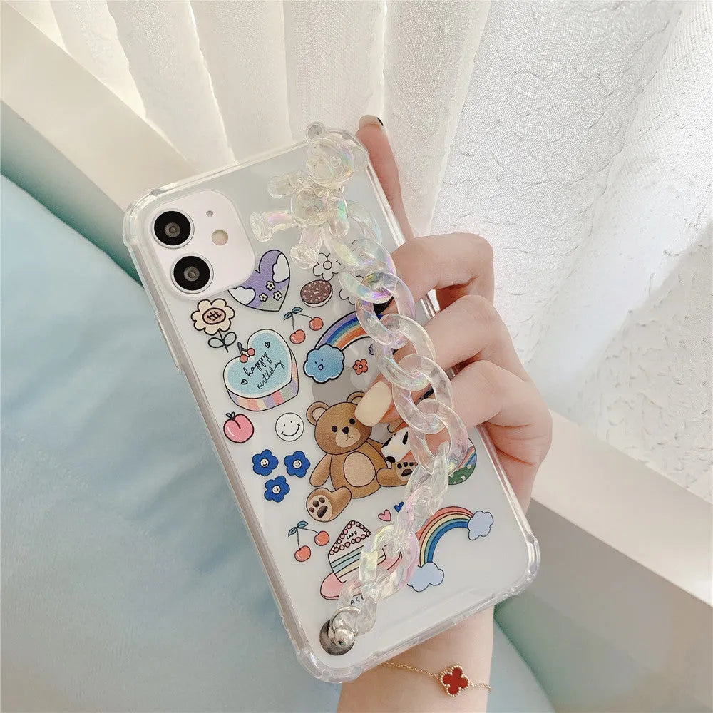 Clear TPU iPhone case with an attached bear chain and cartoon pendant charm