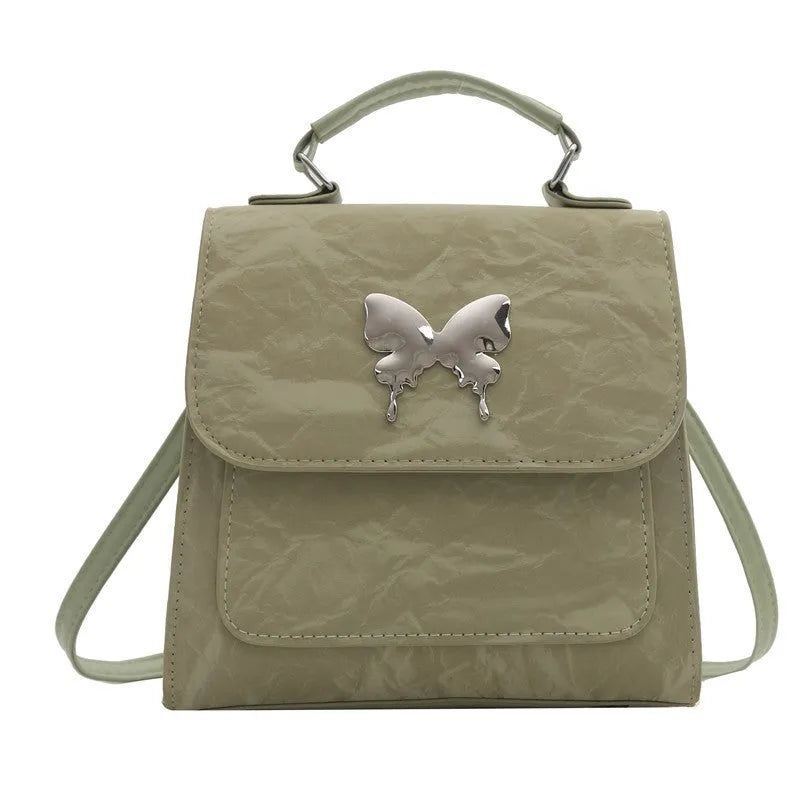 Preppy style women's backpack handbag in PU leather with bow detailing and six colour options