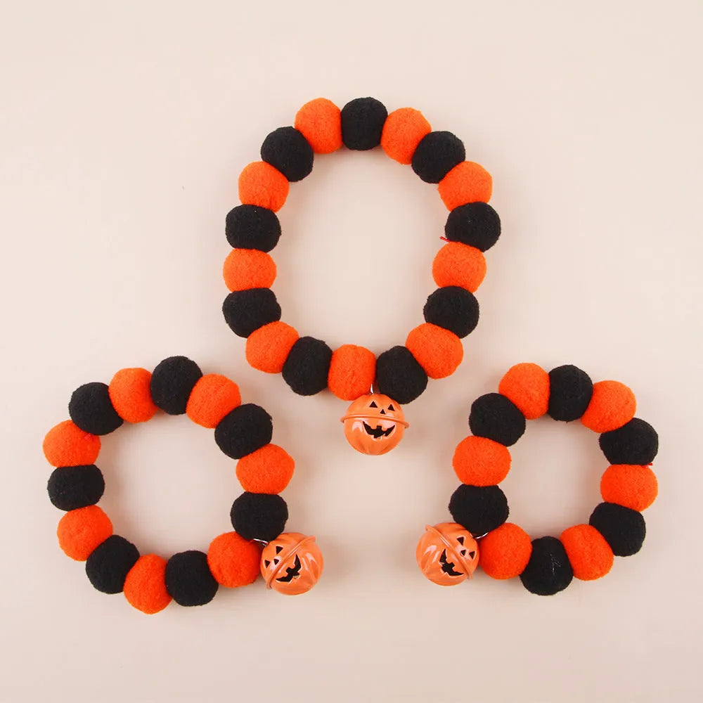 Orange Halloween cat collar with pumpkin design and adjustable snap buckle in three sizes