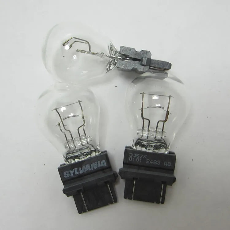 Wagner brake light bulb with dual wires, plastic alignment dots, and 16mm socket
