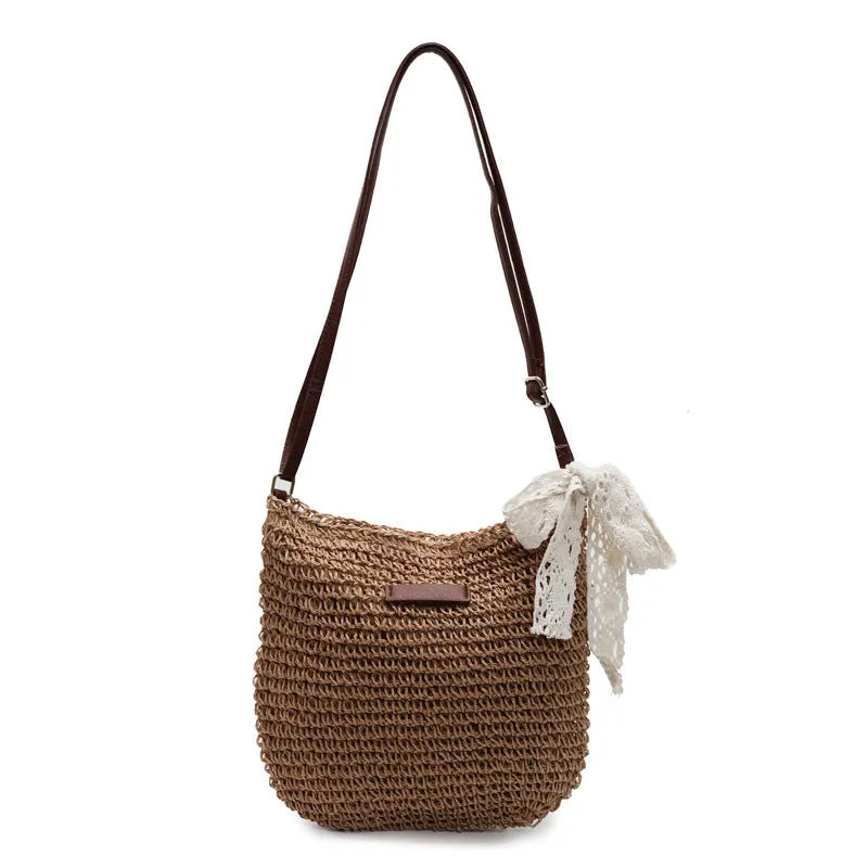 Women's woven straw shoulder messenger bag in khaki with zip pocket and single strap.