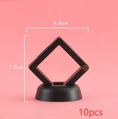 3D floating display case holding coins and jewellery between transparent membrane sheets