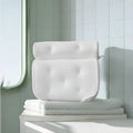 White 4D mesh bathtub pillow with 7 suction cups on a smooth bath surface.