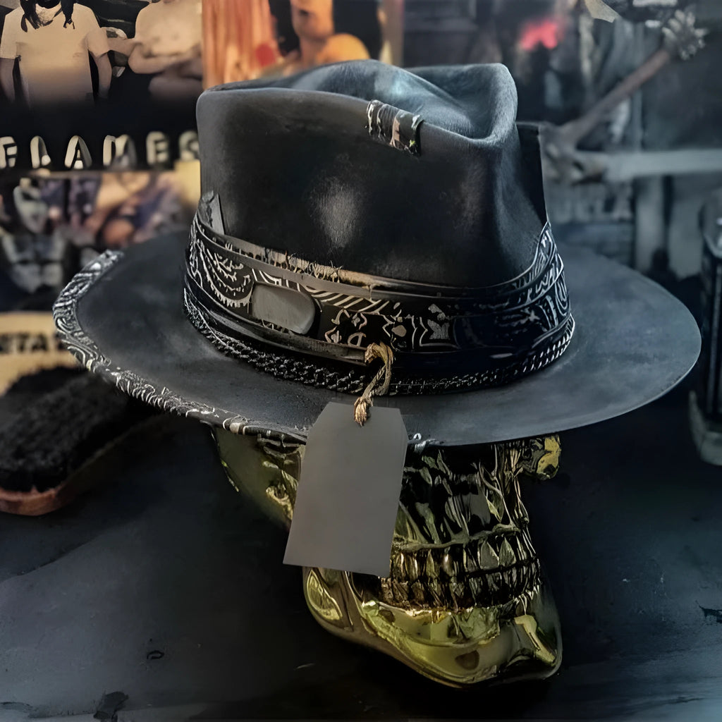 Handmade wool felt skull hat with a pointed conical crown on a neutral background.