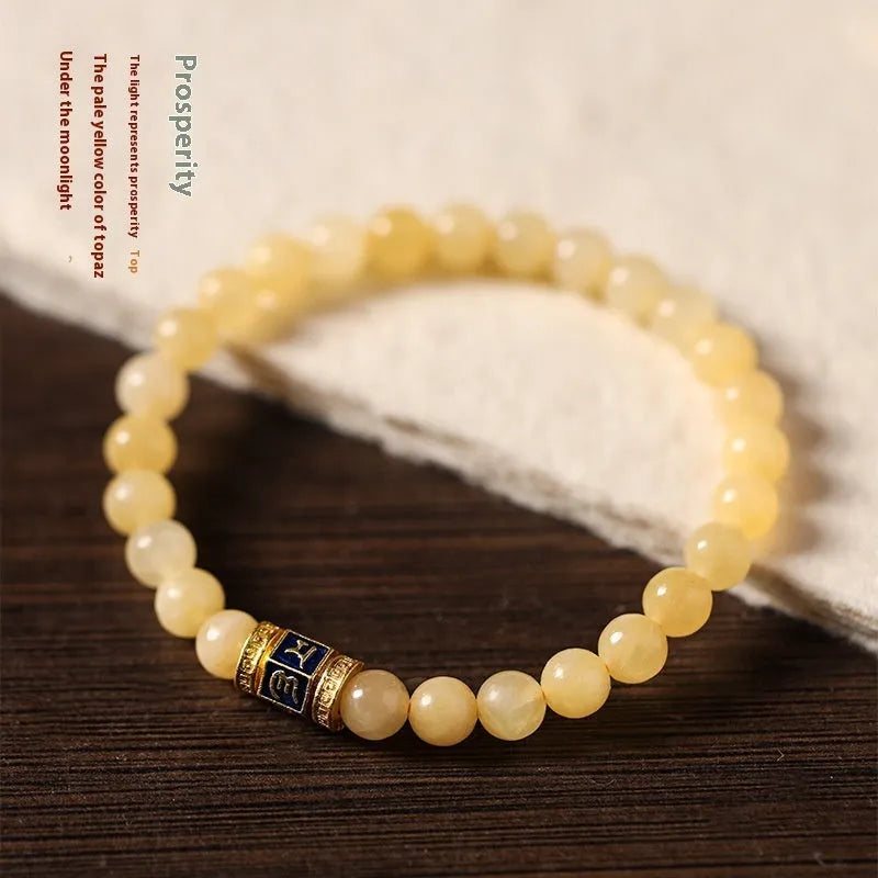 Women's hand-woven topaz bracelet with mantra barrel beads and square jade accents