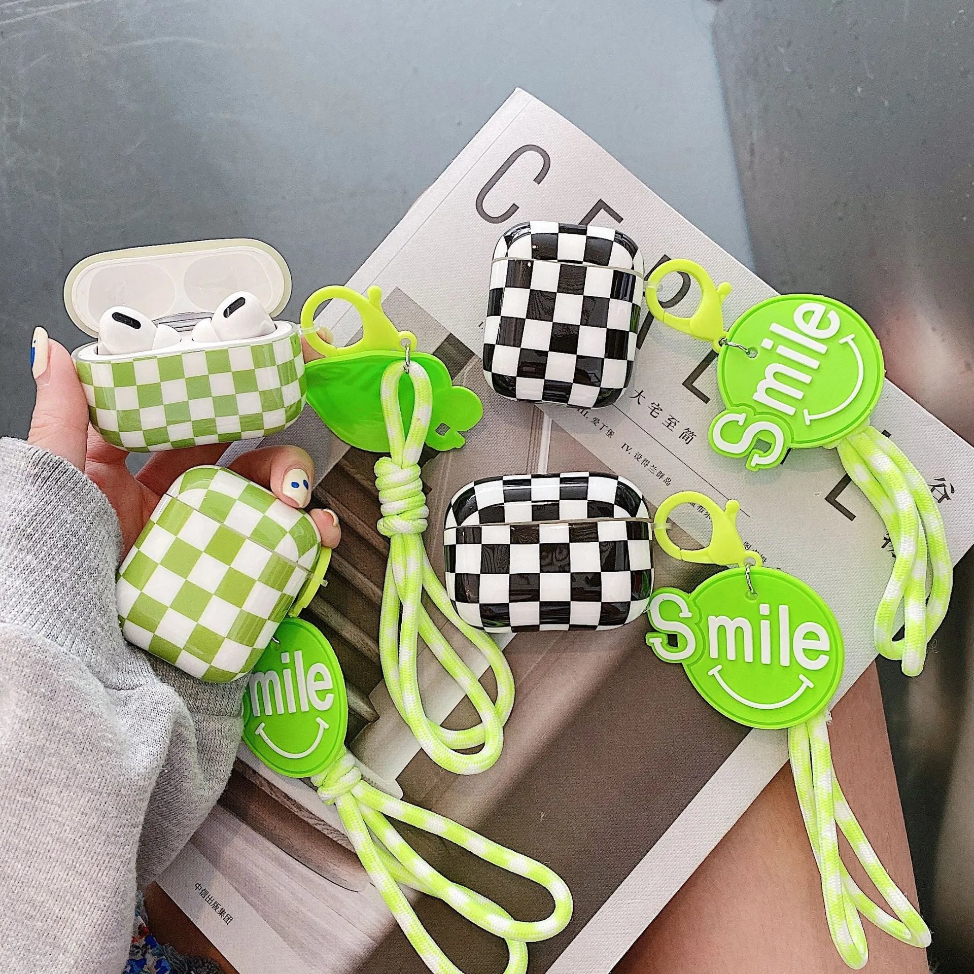 Black and green checkerboard pattern TPU case for Apple AirPods with optional pendant attachments