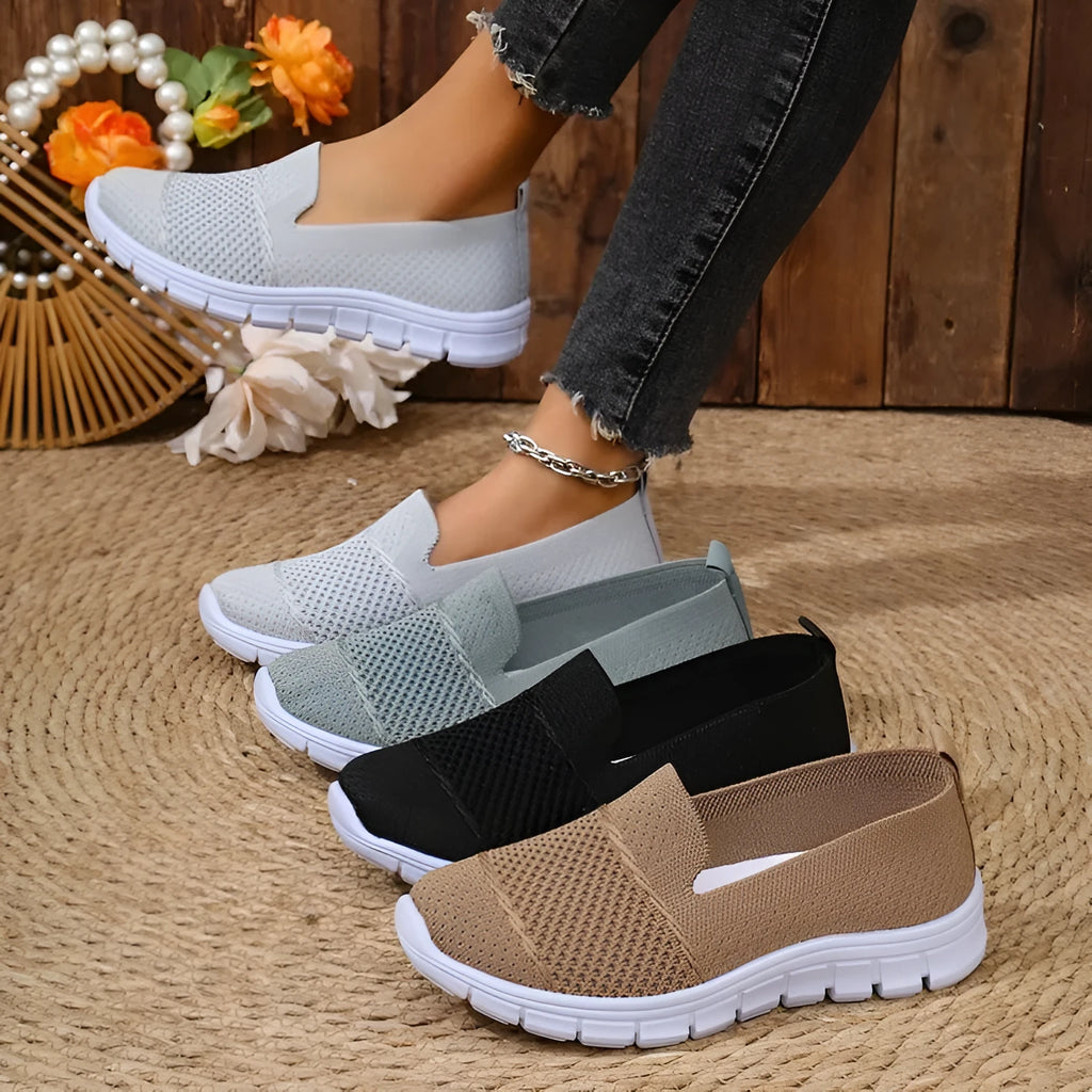 Women's mesh breathable flat casual shoes in black, round toe, PVC sole, side view