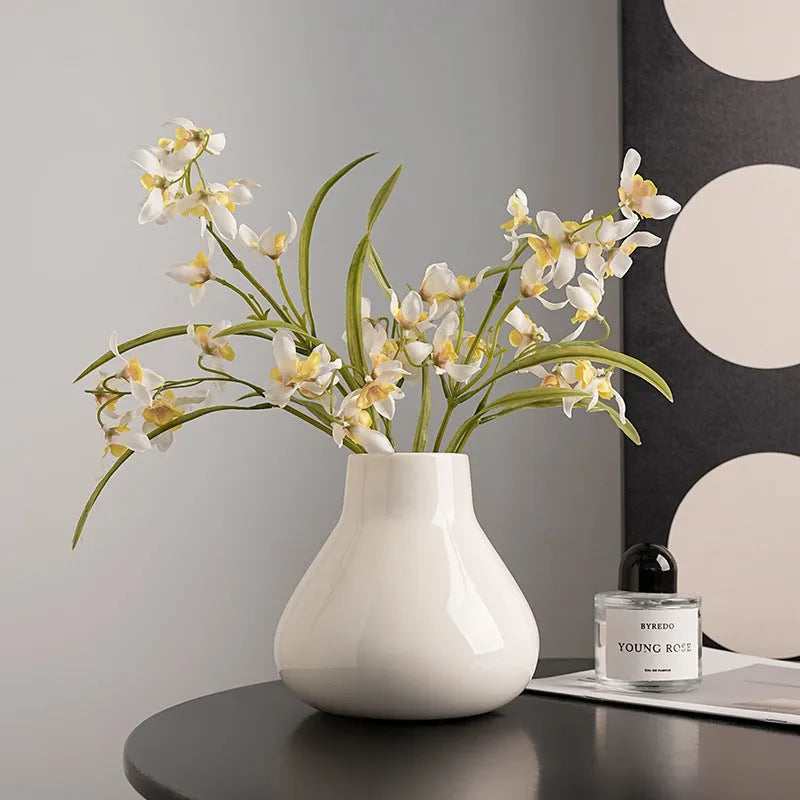 Ceramic round belly vase with black or white coloured glaze finish and modern simplicity design