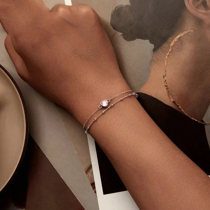Sweet girlish 925 sterling silver bracelet with heart-shaped pendant on adjustable chain