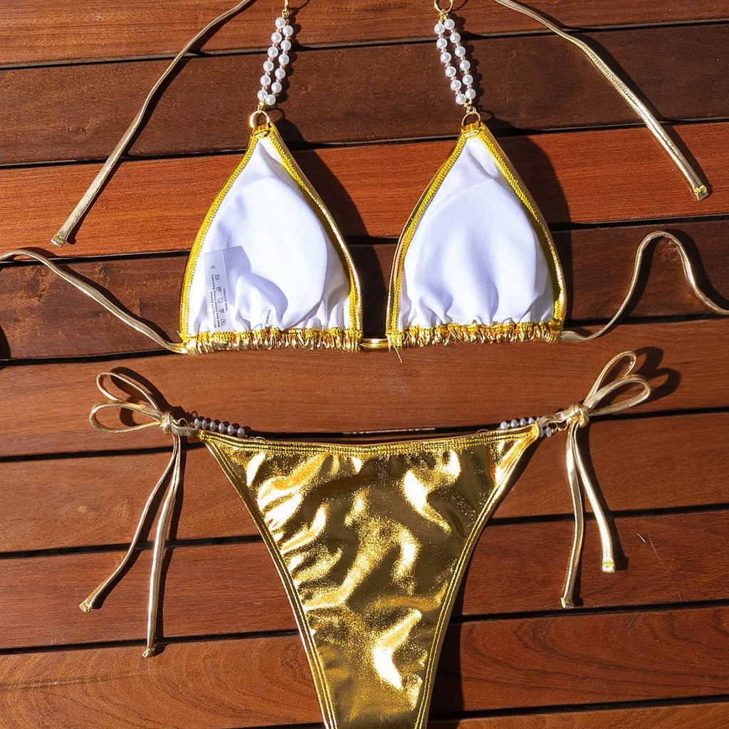 Gold halter lace-up bikini with pearl chain detail and briefs-style bottoms