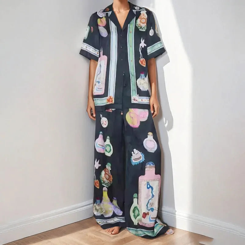 Black women's casual set with cartoon pattern cardigan and matching trousers