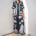 Black women's casual set with cartoon pattern cardigan and matching trousers