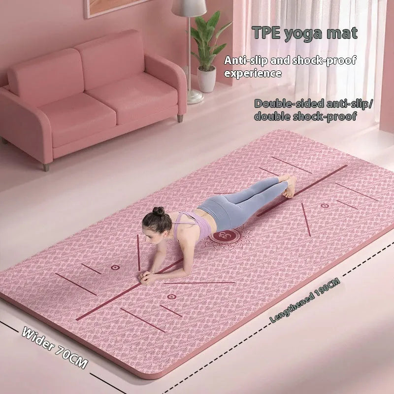 A wide, long non-slip TPE gymnastic mat in a solid colour with alignment guide lines, shown rolled and unrolled.