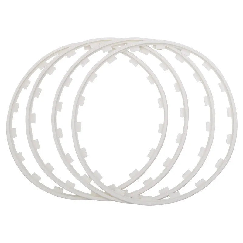 Set of four coloured nylon wheel hub protection rings for alloy wheels.