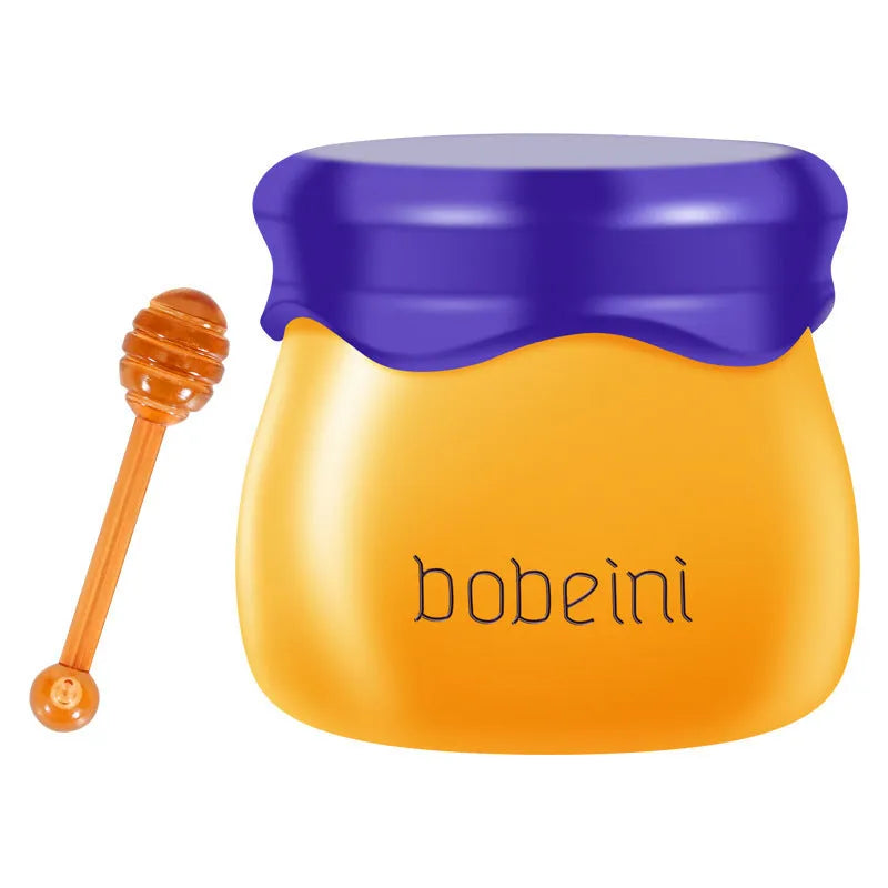 Vaseline lip balm pot in pomegranate or blueberry flavour with small application brush