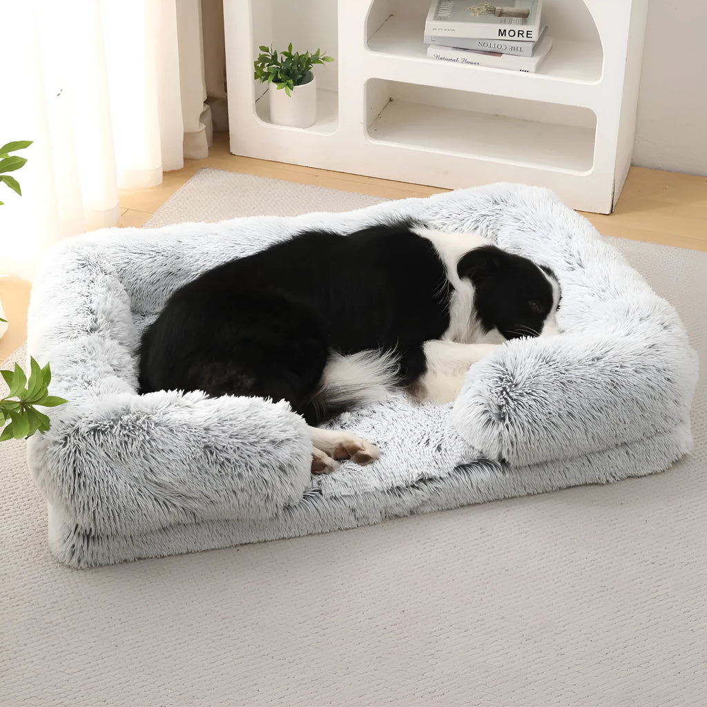 Plush round dog bed in beige brown colour, showing soft texture and round shape with raised edges.