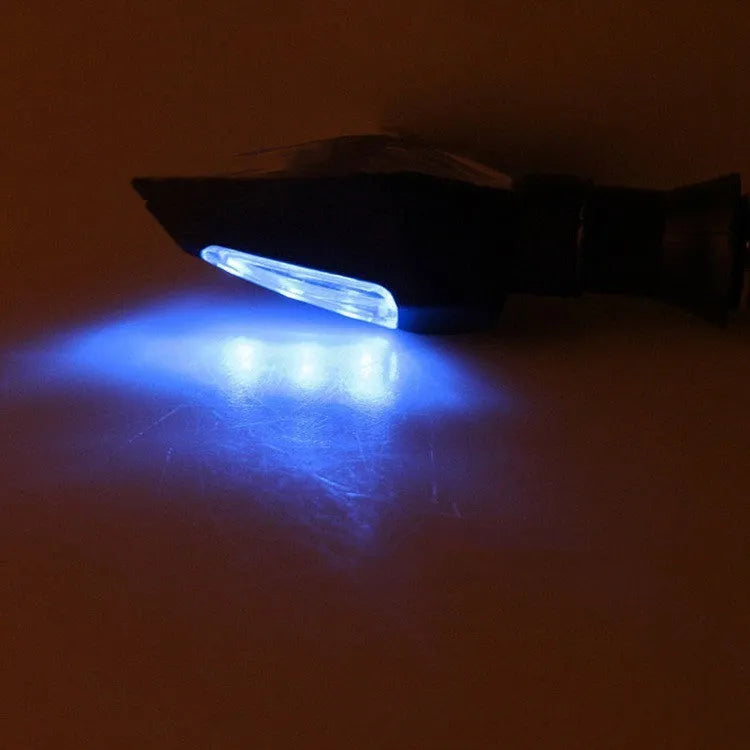 Motorcycle LED turn signal lights showing yellow and blue double-sided luminous indicators