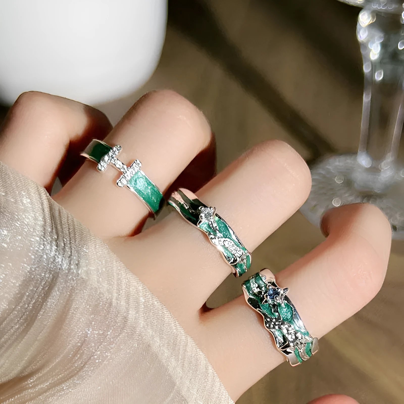 Mint green enamel ring with asymmetrical folded eight-point star design on copper band