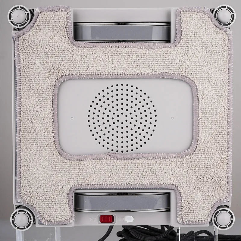White square intelligent window cleaning robot for high-rise windows, showing control panel.