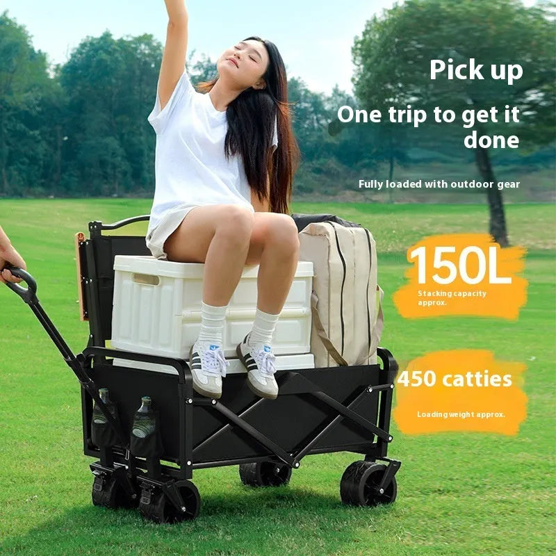 Black outdoor camping trolley with metal frame, 8-inch off-road wheels, and child lying inside, 400kg capacity