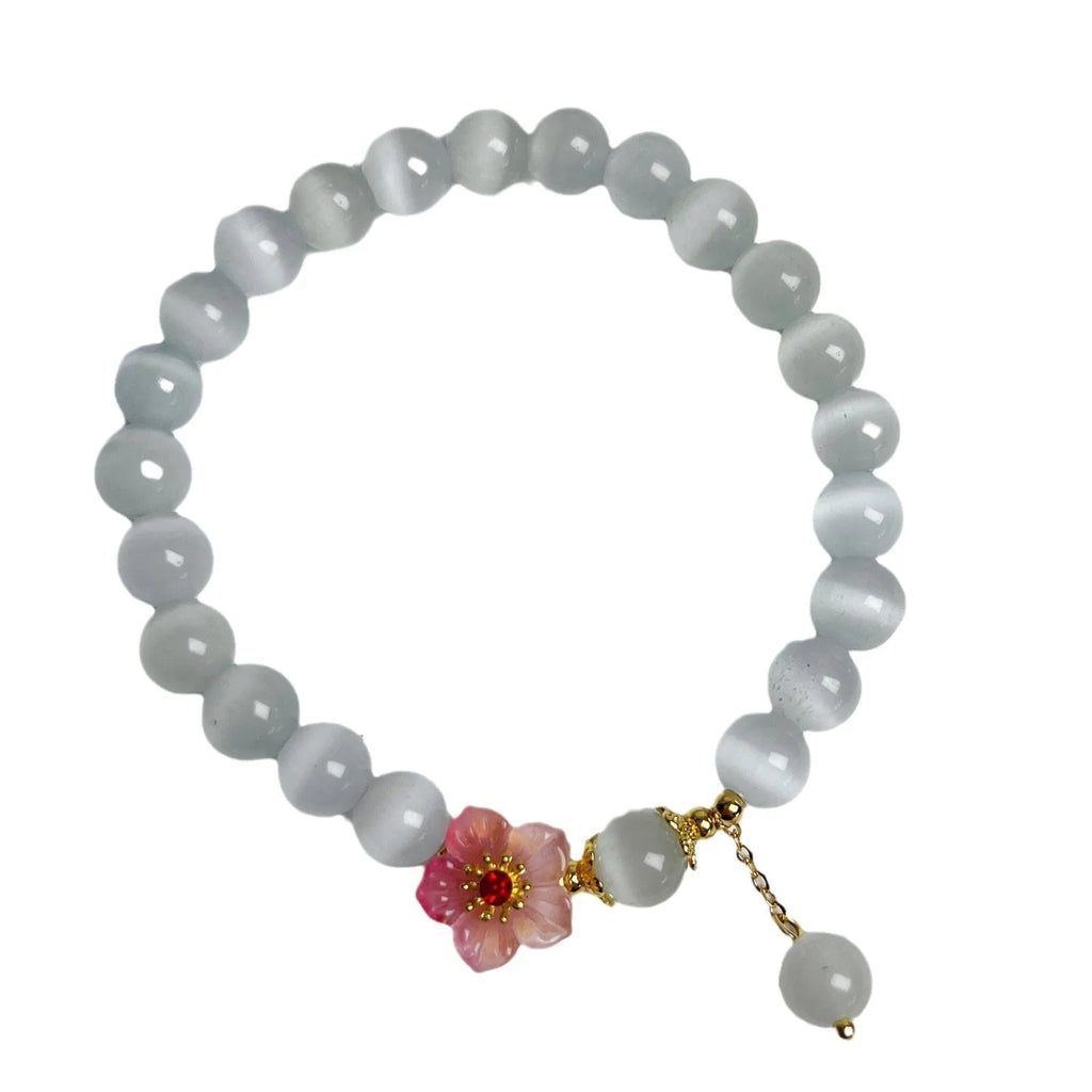 White opal flower beaded bracelet with colourful glaze accents on glass beads.